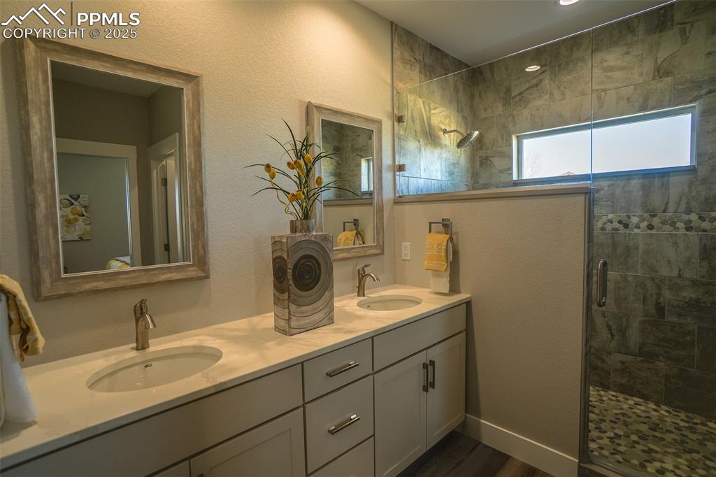 Lot 3 J D Johnson Road Peyton, CO 80831 - Photo 26 of 47 a bathroom with a sink and a mirror