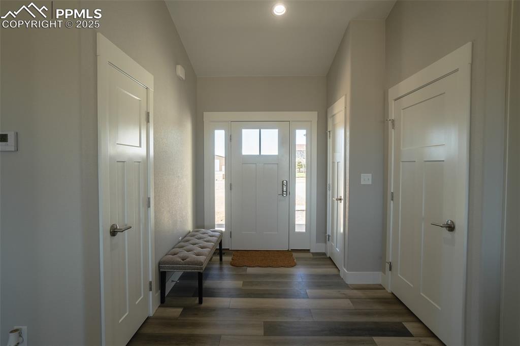 Lot 3 J D Johnson Road Peyton, CO 80831 - Photo 8 of 47 a view of a hallway with entryway wooden floor and front door