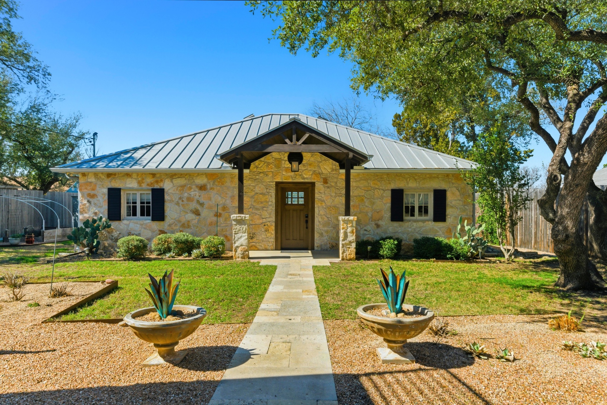 15943 Booth Circle Volente, TX 78641 - Photo 16 of 35 a front view of a house with a yard and garage