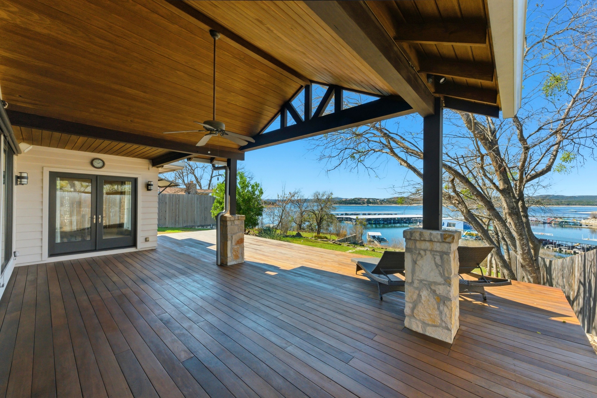 15943 Booth Circle Volente, TX 78641 - Photo 17 of 35 a roof deck with table and chairs and wooden floor