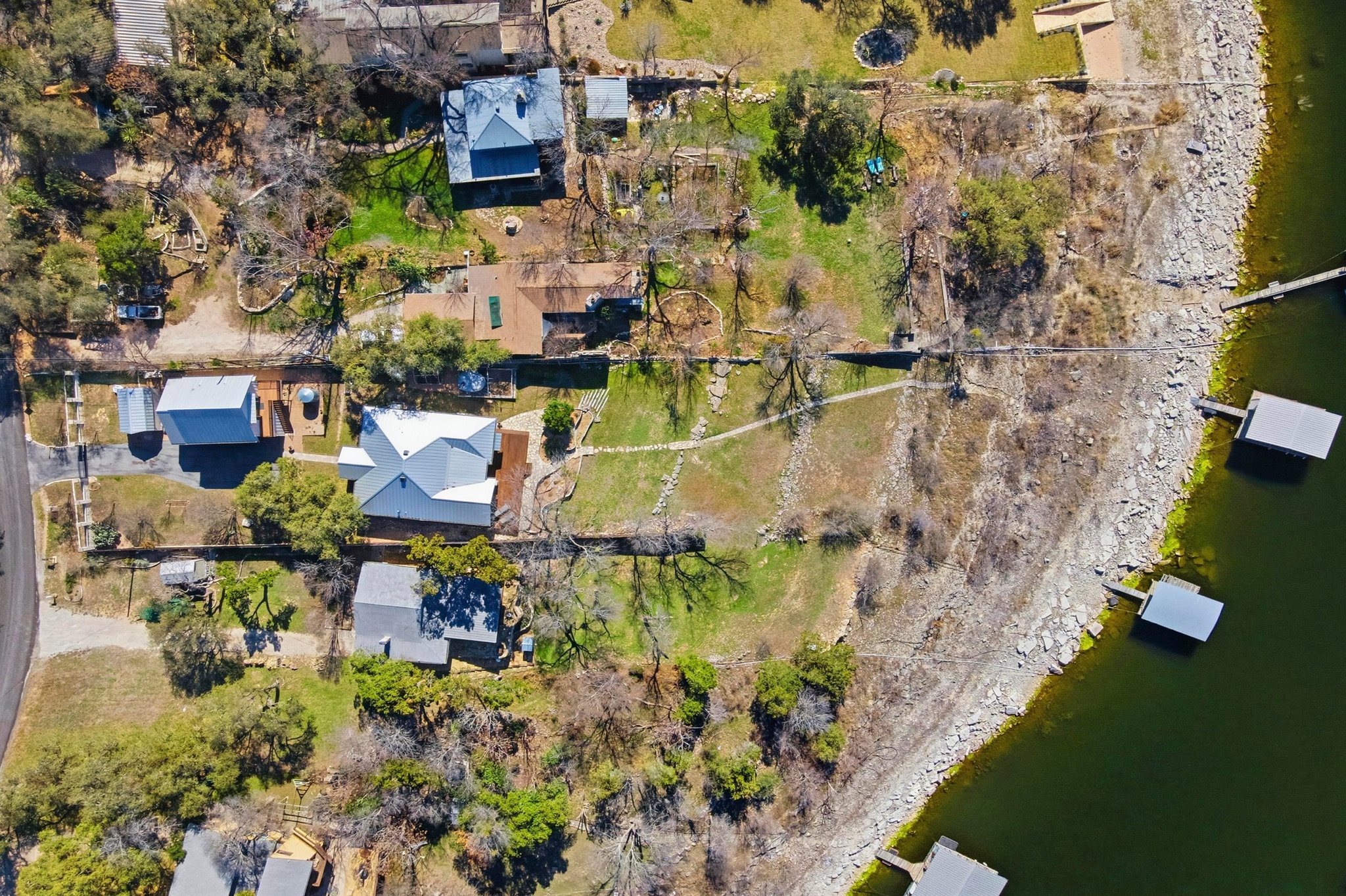 15943 Booth Circle Volente, TX 78641 - Photo 2 of 35 an aerial view of residential house with outdoor space and swimming pool