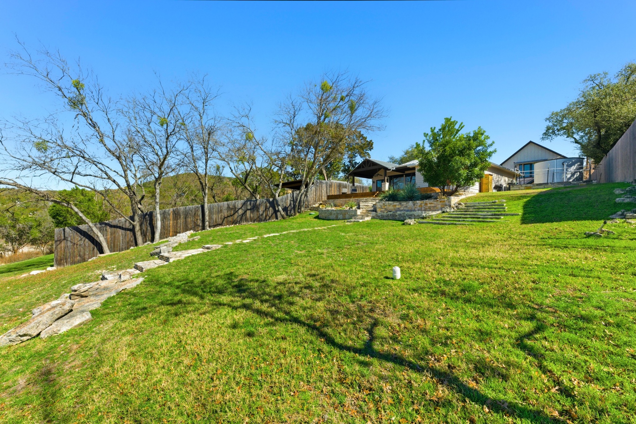 15943 Booth Circle Volente, TX 78641 - Photo 23 of 35 a view of a backyard with a garden