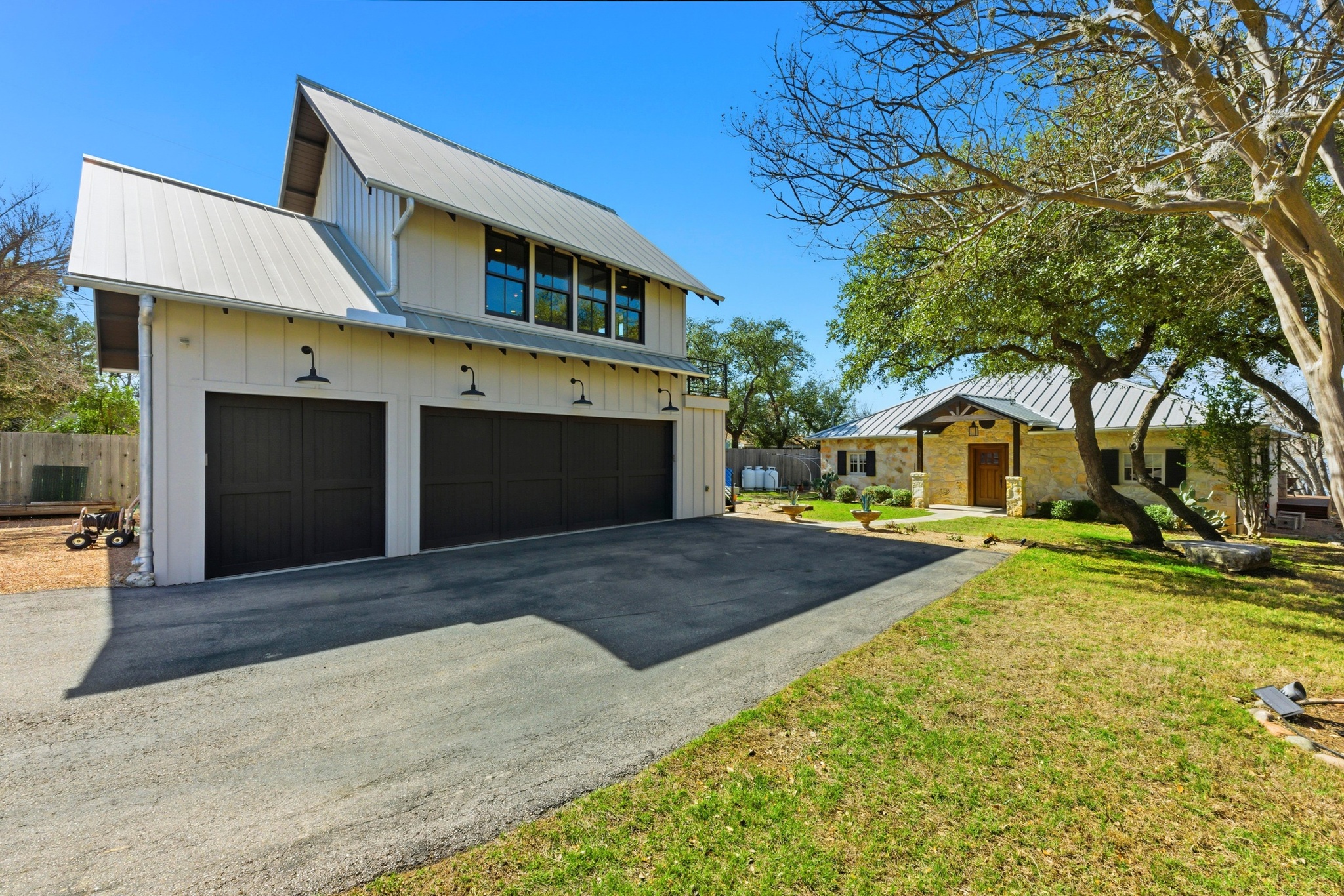 15943 Booth Circle Volente, TX 78641 - Photo 24 of 35 a front view of a house with a yard and garage