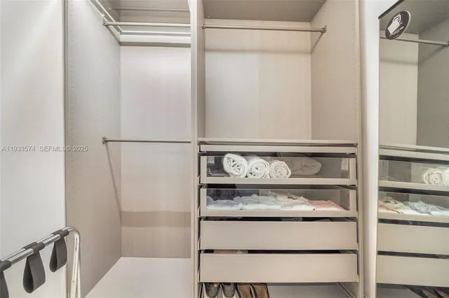 a bathroom with a double vanity sink and mirror