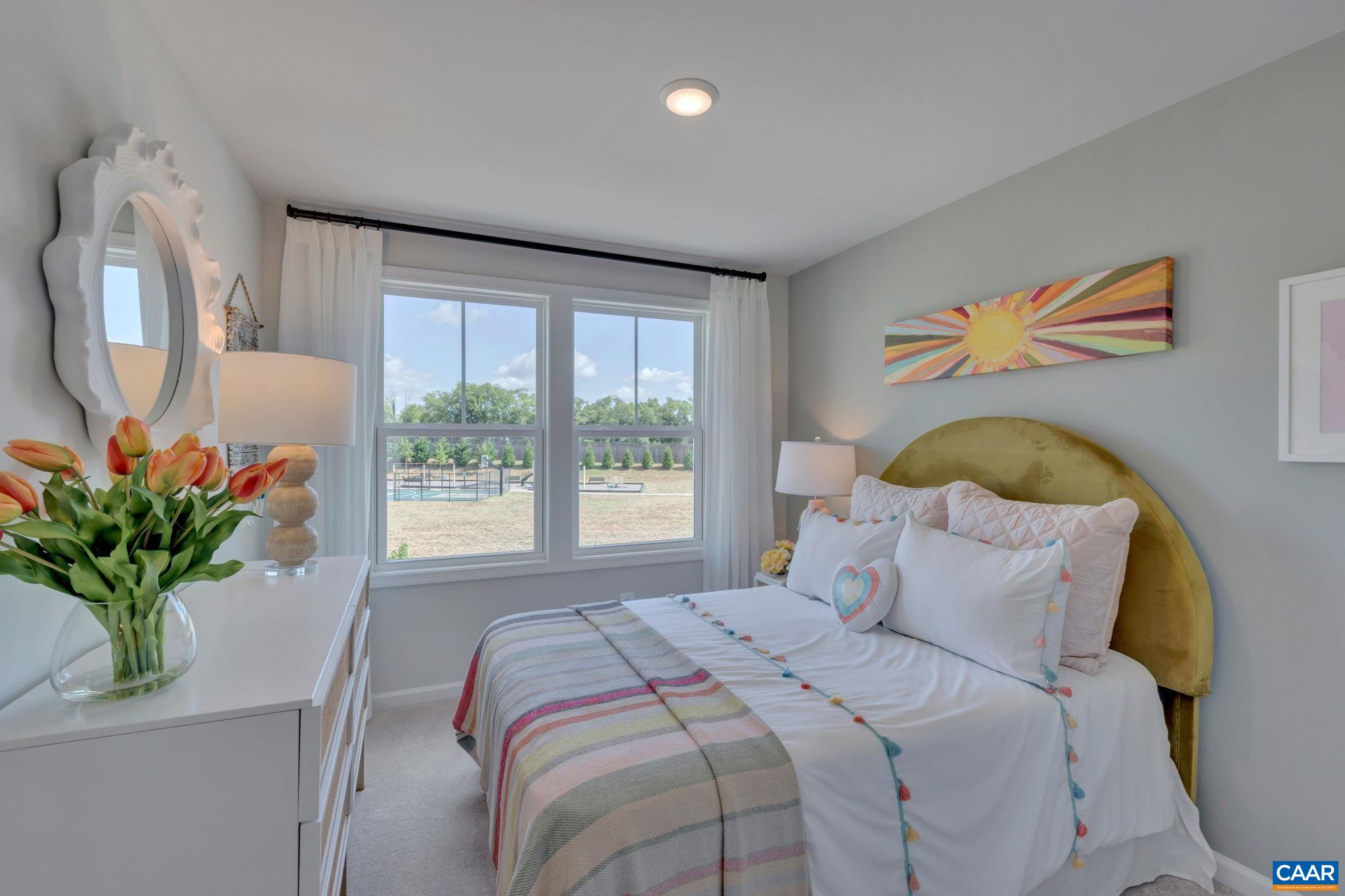 2990 Rambling Brk Lane, Unit LOT 125 Crozet, VA 22932 - Photo 19 of 44 a bedroom with a bed and a potted plant