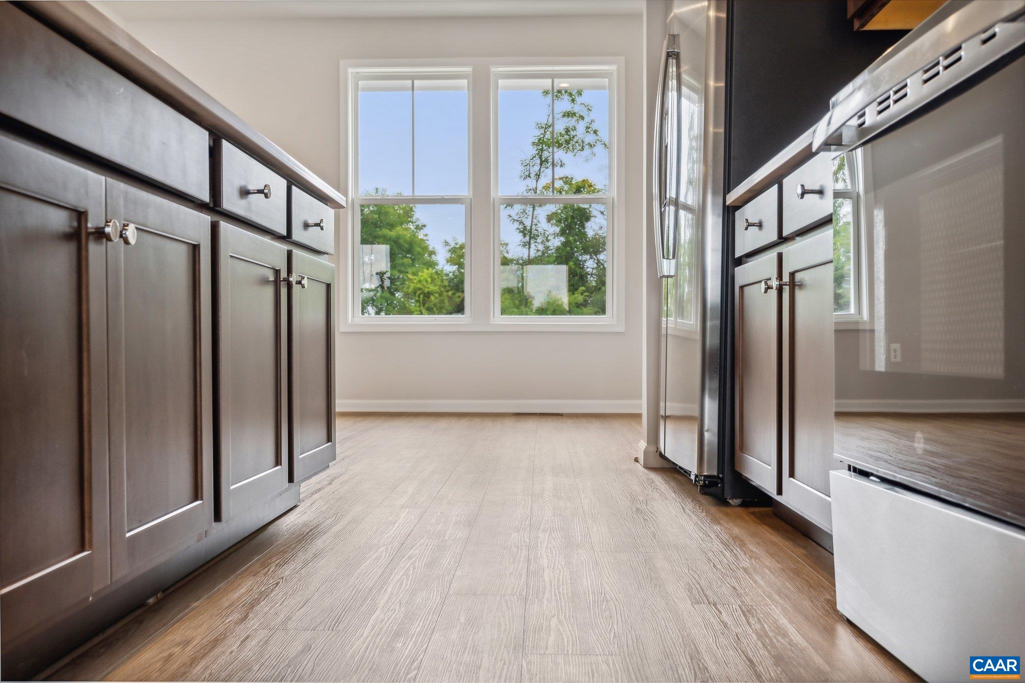 2990 Rambling Brk Lane, Unit LOT 125 Crozet, VA 22932 - Photo 5 of 44 a view of an entryway with wooden floor and door