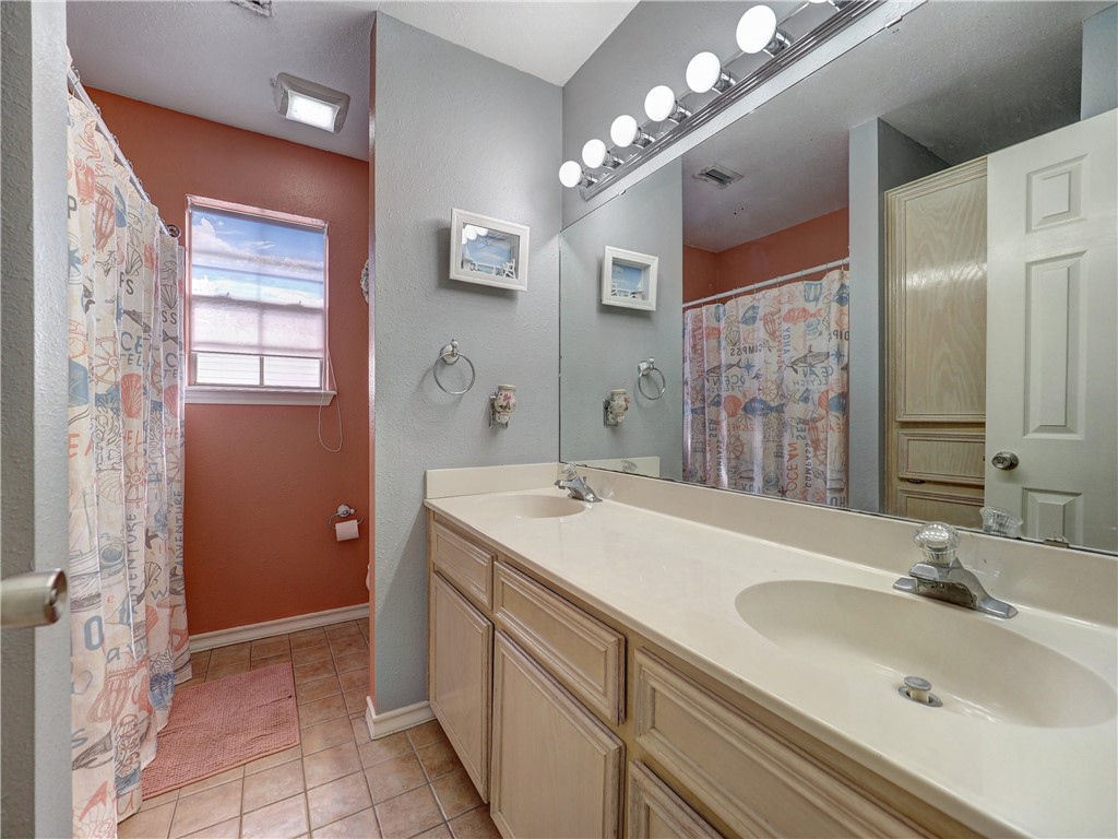 7210 St James Court Corpus Christi, TX 78413 - Photo 21 of 26 Upstairs full bath with double sinks