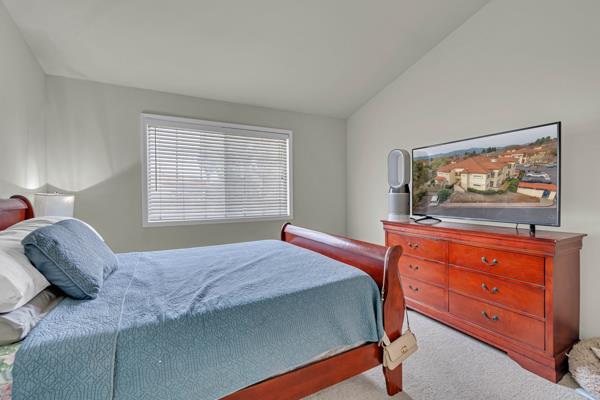 6971 Dublin Meadows Street, Unit F Dublin, CA 94568 - Photo 14 of 29 a bedroom with a bed and a dresser in it