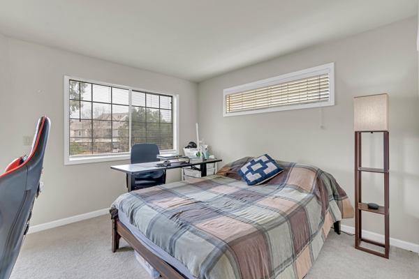 6971 Dublin Meadows Street, Unit F Dublin, CA 94568 - Photo 20 of 29 a bedroom with a bed and wooden floor
