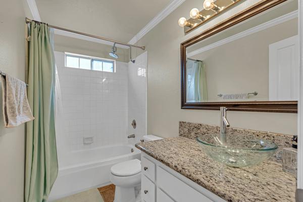 6971 Dublin Meadows Street, Unit F Dublin, CA 94568 - Photo 21 of 29 a bathroom with a granite countertop sink toilet and shower