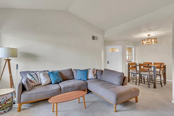 6971 Dublin Meadows Street, Unit F Dublin, CA 94568 - Photo 4 of 29 a living room with furniture a desk and chair