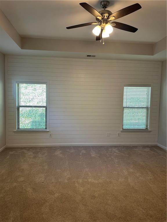 403 Village View Woodstock, GA 30188 - Photo 17 of 35 an empty room with a window and a fan