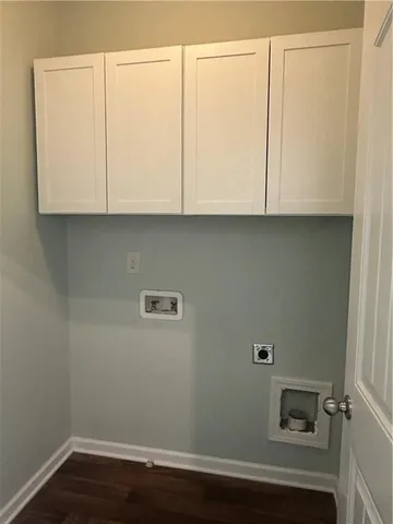 a view of cabinets and wooden floor