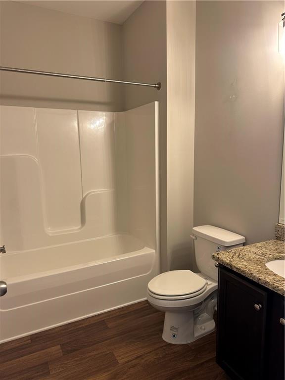 403 Village View Woodstock, GA 30188 - Photo 24 of 35 a bathroom with a granite countertop toilet and a shower