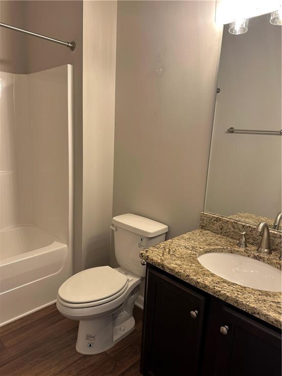 403 Village View Woodstock, GA 30188 - Photo 25 of 35 a bathroom with a granite countertop sink toilet and shower