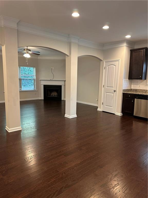 403 Village View Woodstock, GA 30188 - Photo 3 of 35 an empty room with wooden floor fireplace and windows