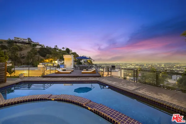 a view of a balcony with city view