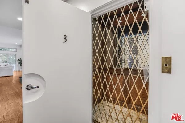a bathroom with a shower curtain and a sink