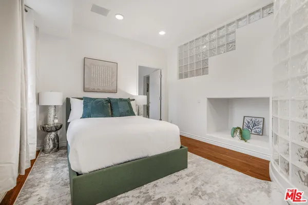 a bedroom with a bed and a cabinets