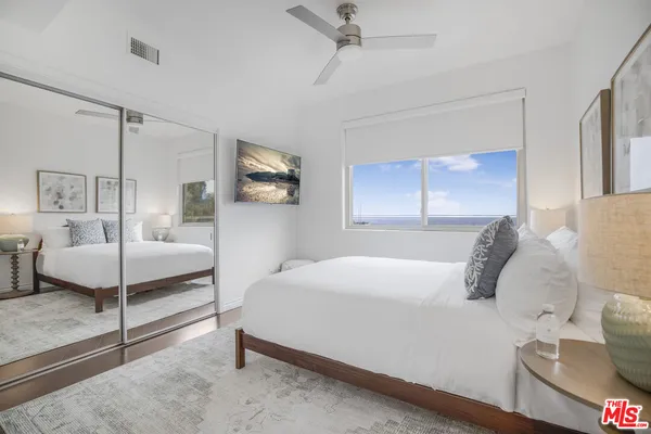 a bedroom with a large bed and a table