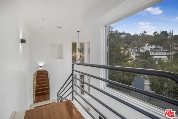 a view of a balcony with furniture