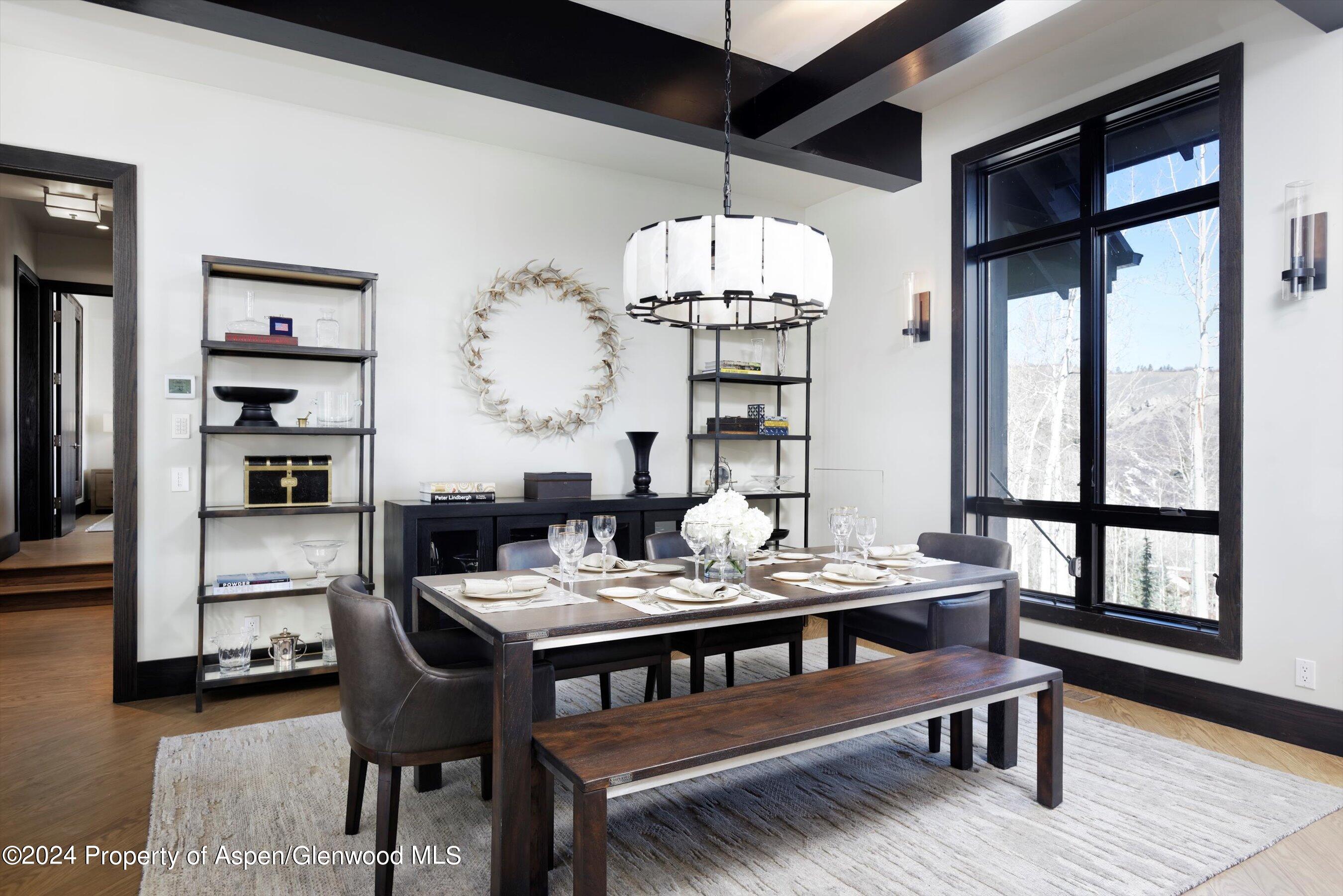 32 Elk Ridge Lane Snowmass Village, CO 81615 - Photo 21 of 58 a view of a dining room with furniture window and wooden floor