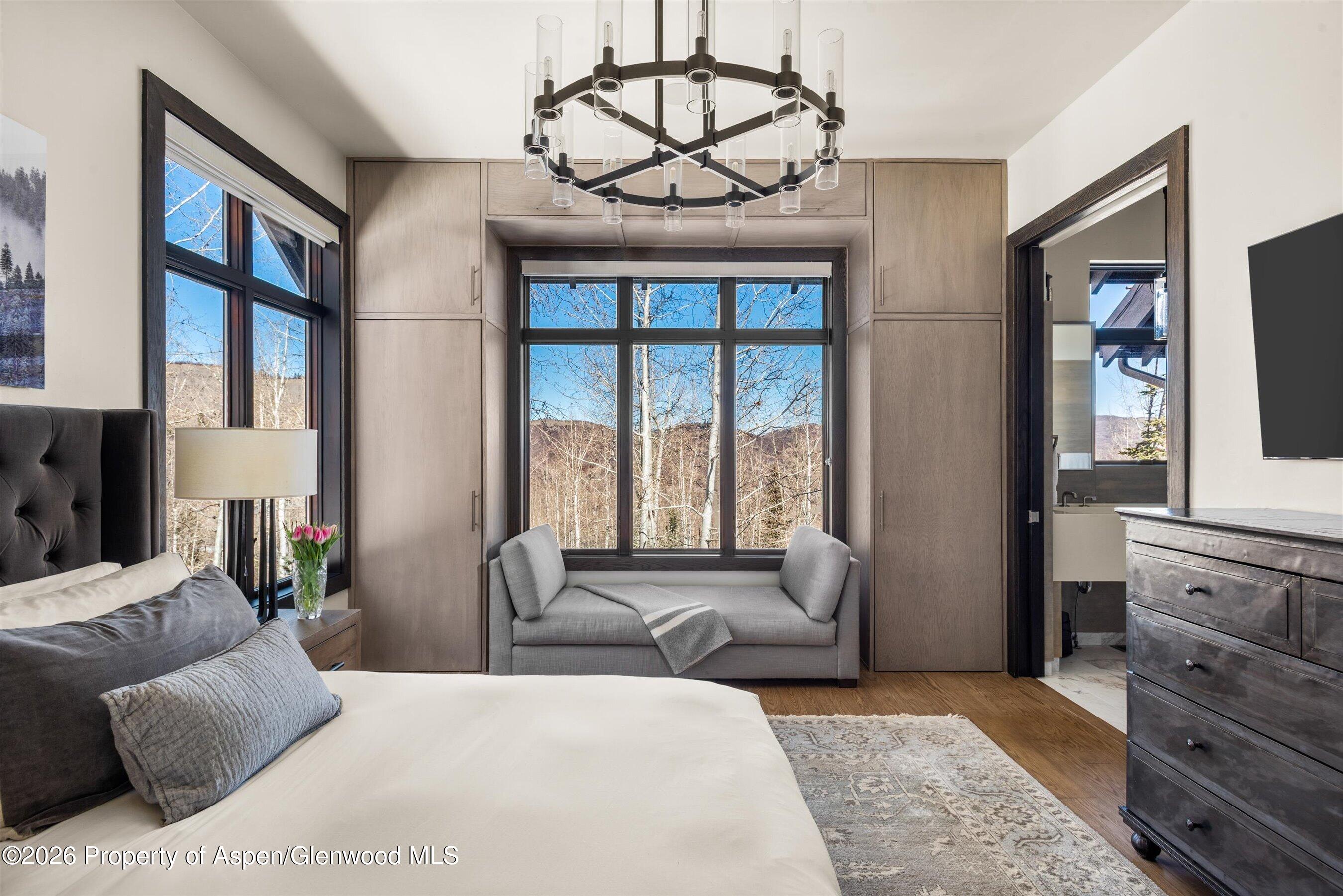 32 Elk Ridge Lane Snowmass Village, CO 81615 - Photo 25 of 58 a bedroom with a large bed and a window