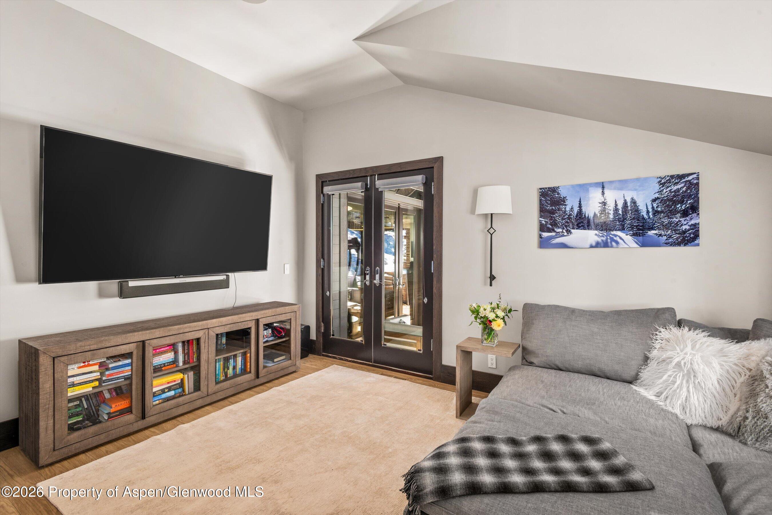 32 Elk Ridge Lane Snowmass Village, CO 81615 - Photo 39 of 58 a living room with furniture and a flat screen tv
