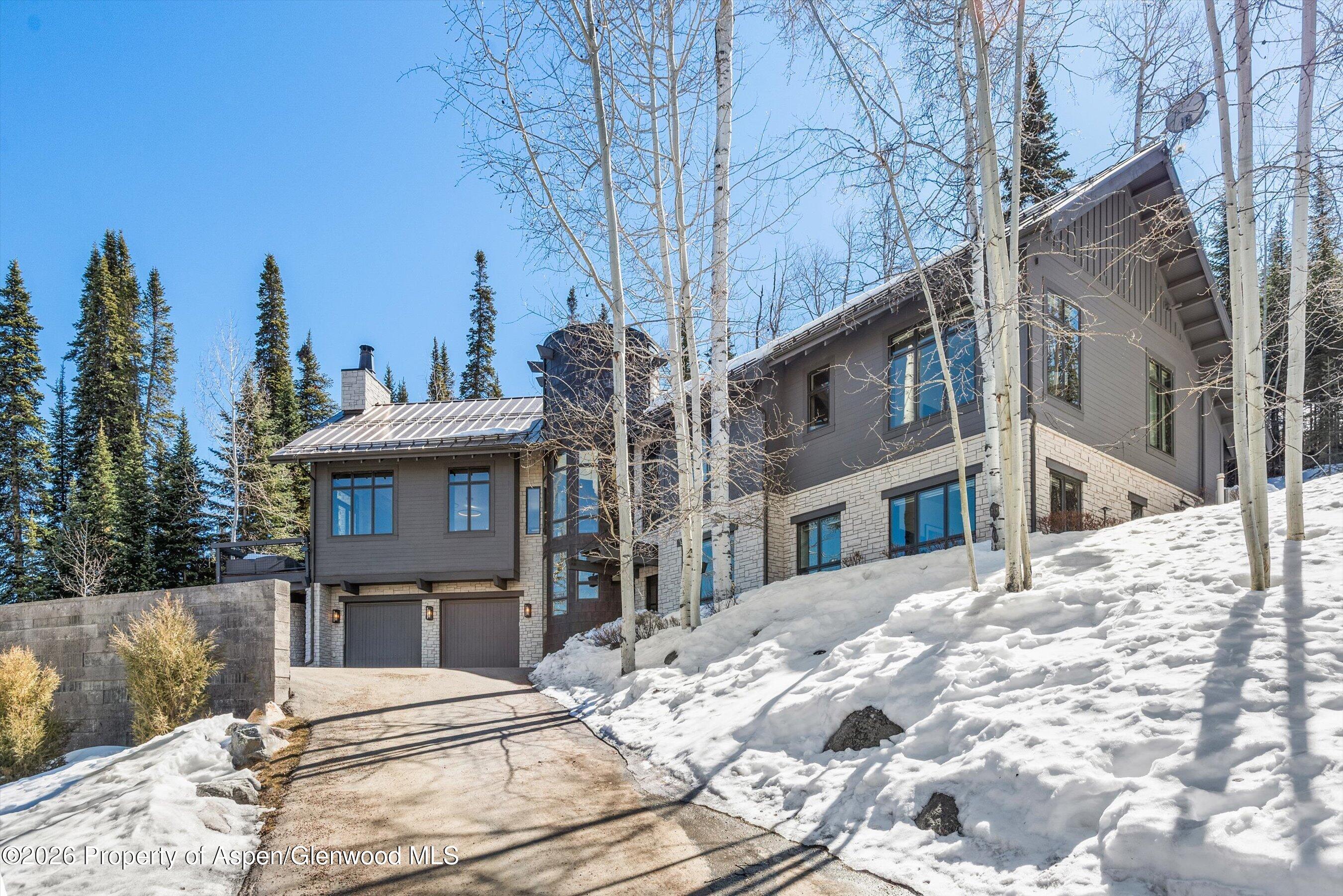 32 Elk Ridge Lane Snowmass Village, CO 81615 - Photo 4 of 58 a view of a house with snow on the background