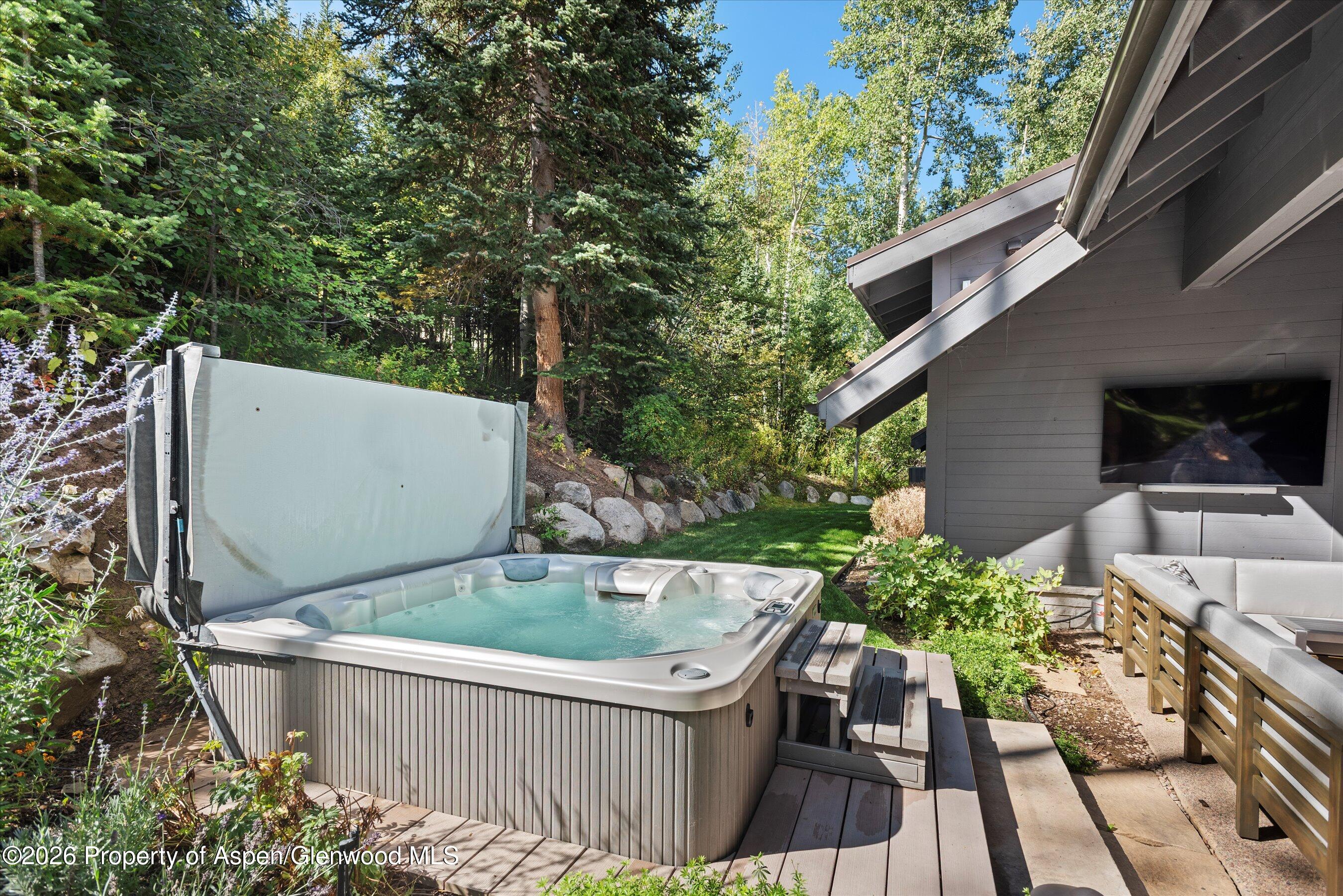 32 Elk Ridge Lane Snowmass Village, CO 81615 - Photo 47 of 58 Jacuzzi on Patio Summer