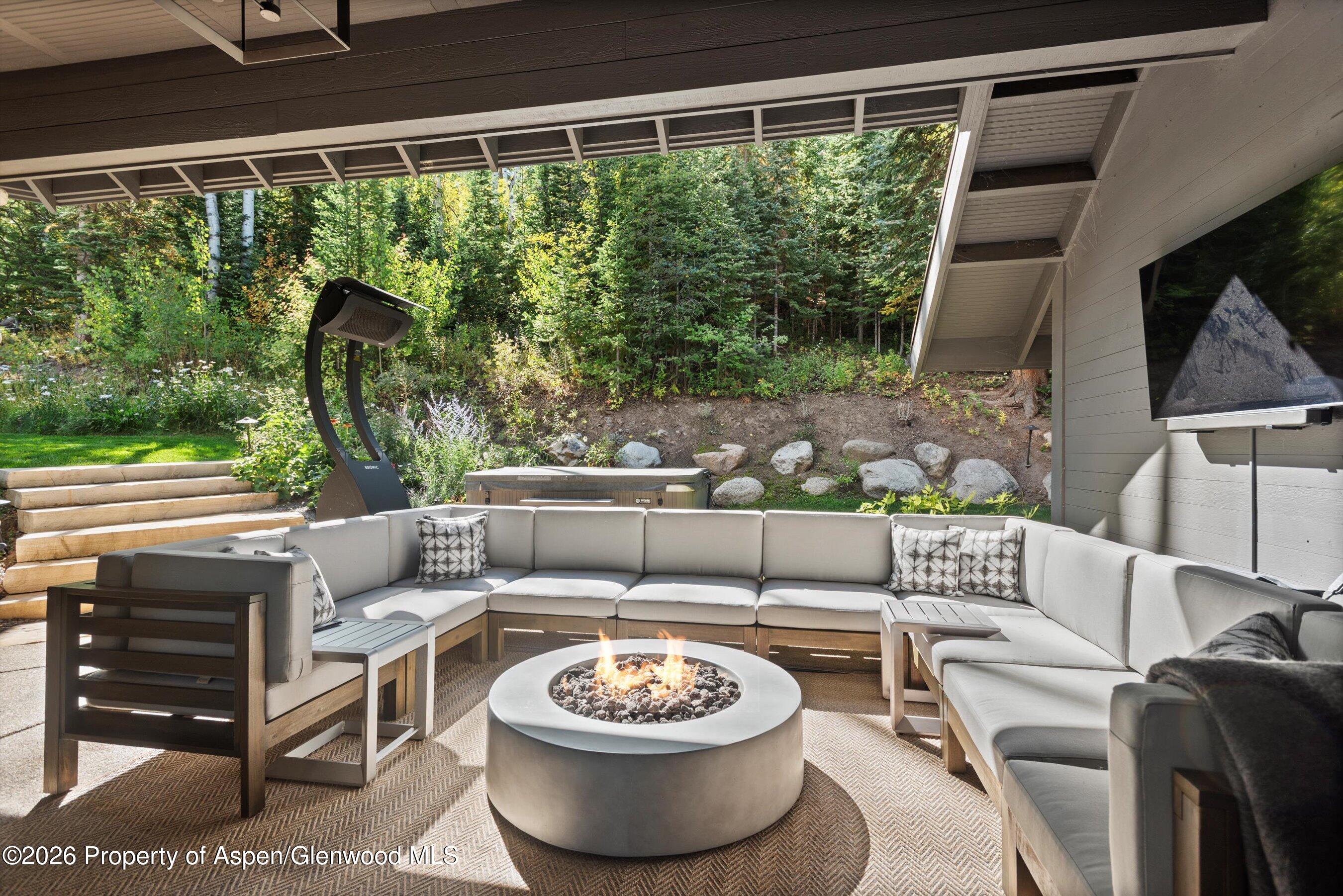 32 Elk Ridge Lane Snowmass Village, CO 81615 - Photo 50 of 58 a outdoor living space with furniture and a potted plant