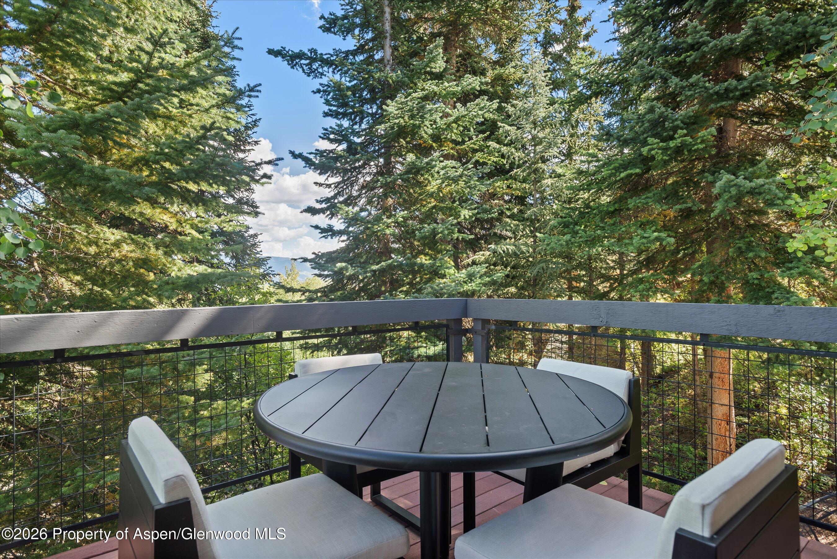 32 Elk Ridge Lane Snowmass Village, CO 81615 - Photo 54 of 58 a view of a balcony with chairs