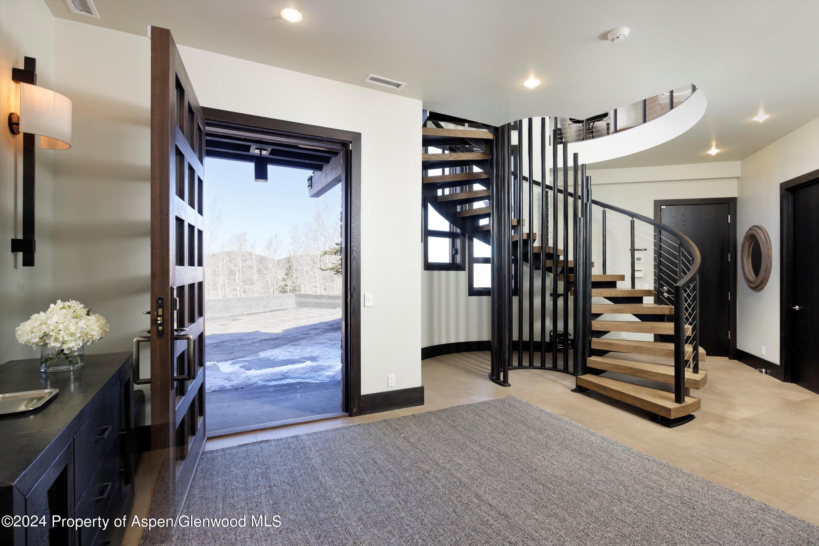 32 Elk Ridge Lane Snowmass Village, CO 81615 - Photo 9 of 58 a view of hallway with stairs and furniture