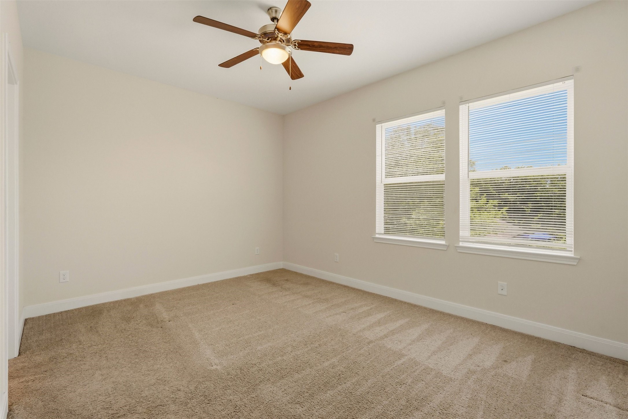 2218 Bringhurst Street, Unit B Houston, TX 77026 - Photo 21 of 25 an empty room with a window and a fan