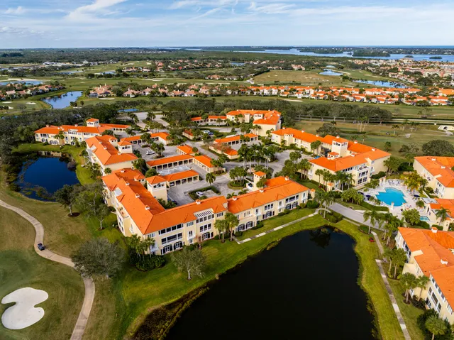 an aerial view of residential houses with wooden floor and city view