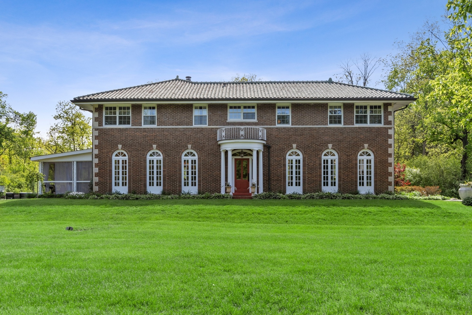 1900 Telegraph Road Bannockburn, IL 60015 - Photo 3 of 47 a front view of a house with a garden