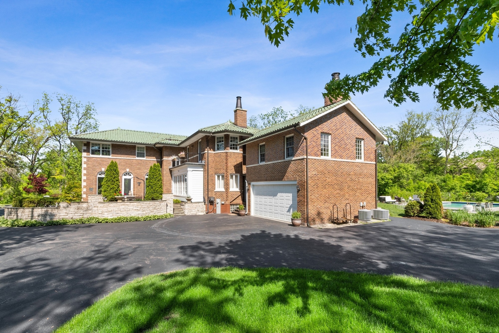 1900 Telegraph Road Bannockburn, IL 60015 - Photo 35 of 47 a front view of a house with a yard and garage