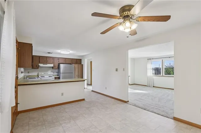 a view of a kitchen with a sink and cabinet area