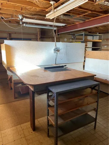 a room with a table and chairs