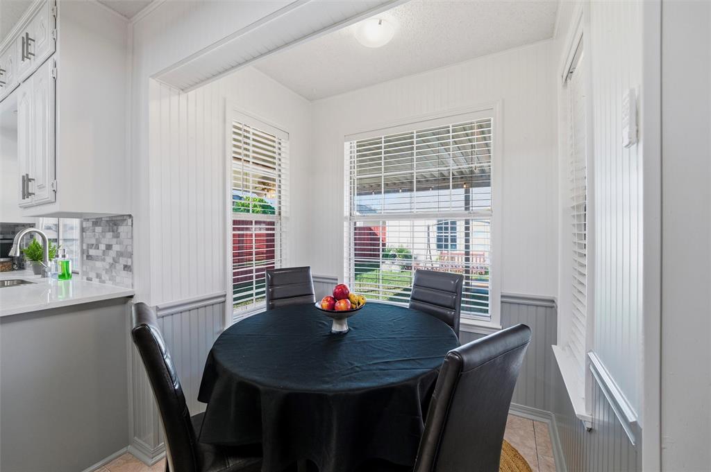 1801 Homestead Place Garland, TX 75044 - Photo 16 of 37 a view of a dining room with a table and chairs