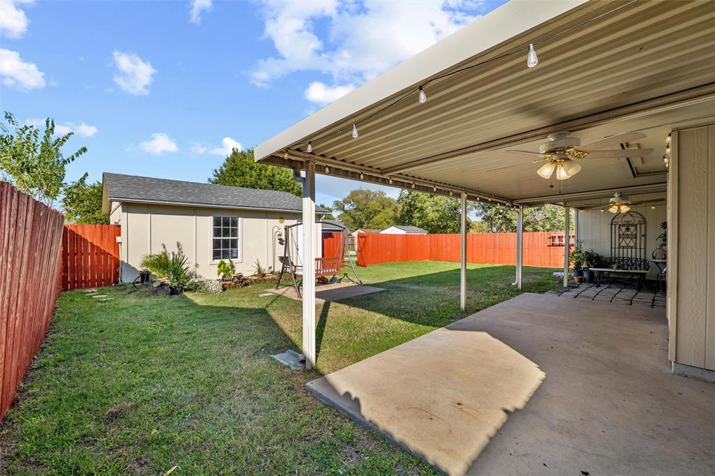 1801 Homestead Place Garland, TX 75044 - Photo 32 of 37 a view of a house with backyard and a porch