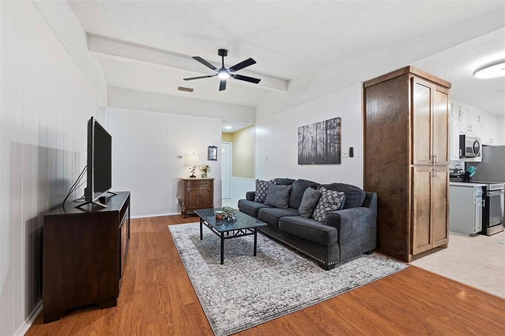 1801 Homestead Place Garland, TX 75044 - Photo 10 of 37 a living room with furniture and a rug
