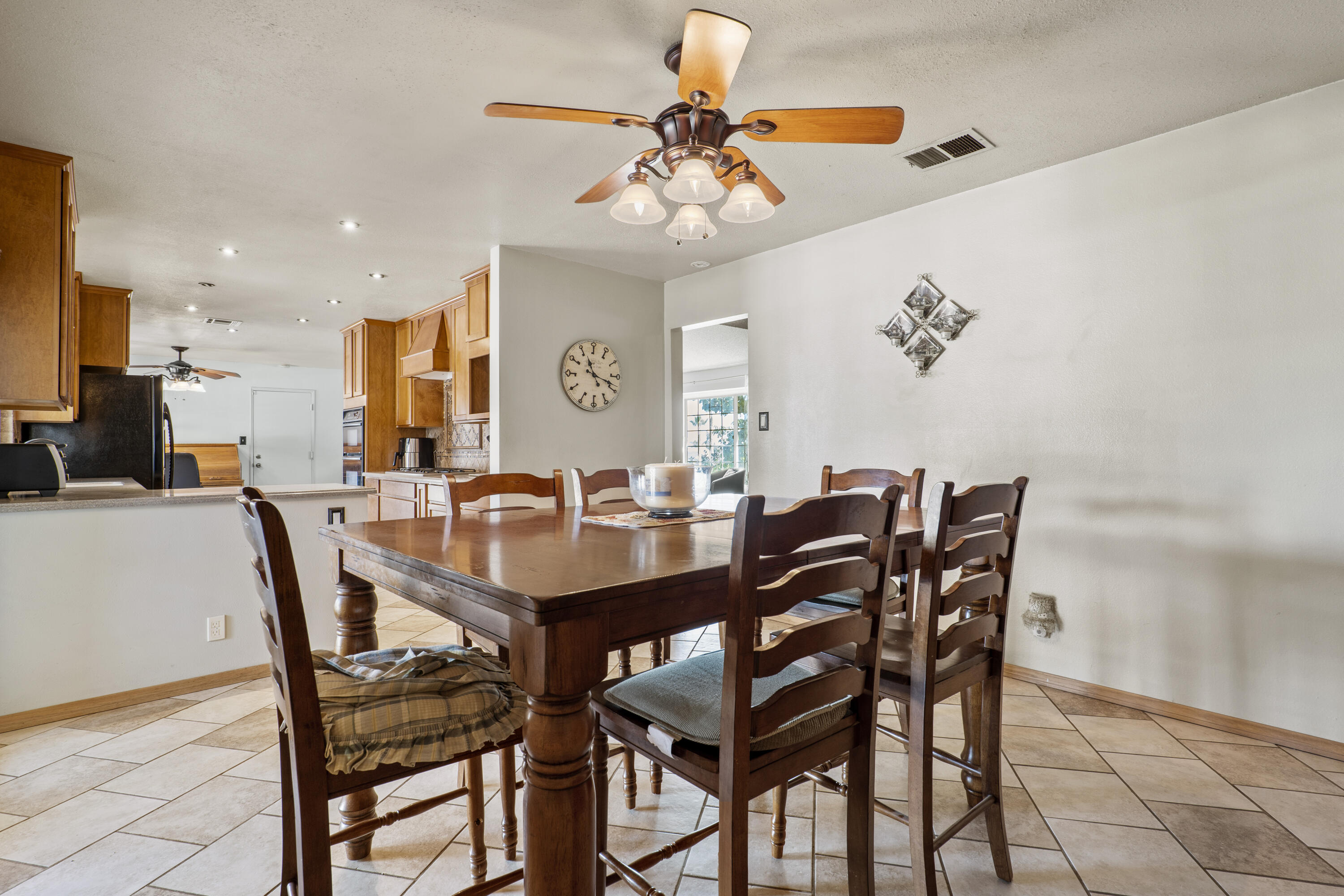 41235 47th Street West Lancaster, CA 93536 - Photo 11 of 43 a view of a dining room with furniture and chandelier