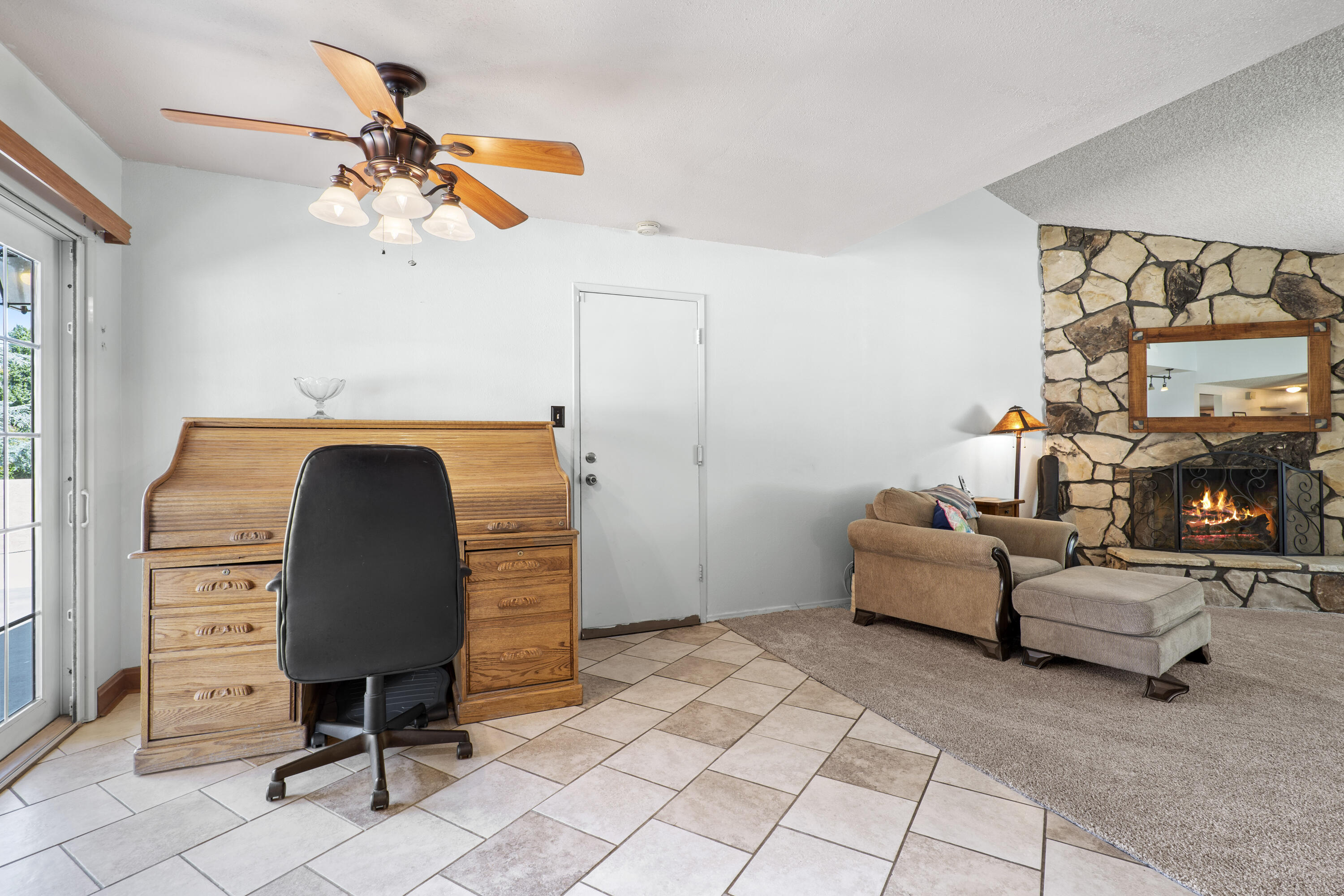 41235 47th Street West Lancaster, CA 93536 - Photo 13 of 43 a bedroom with a bed a chandelier and a dresser