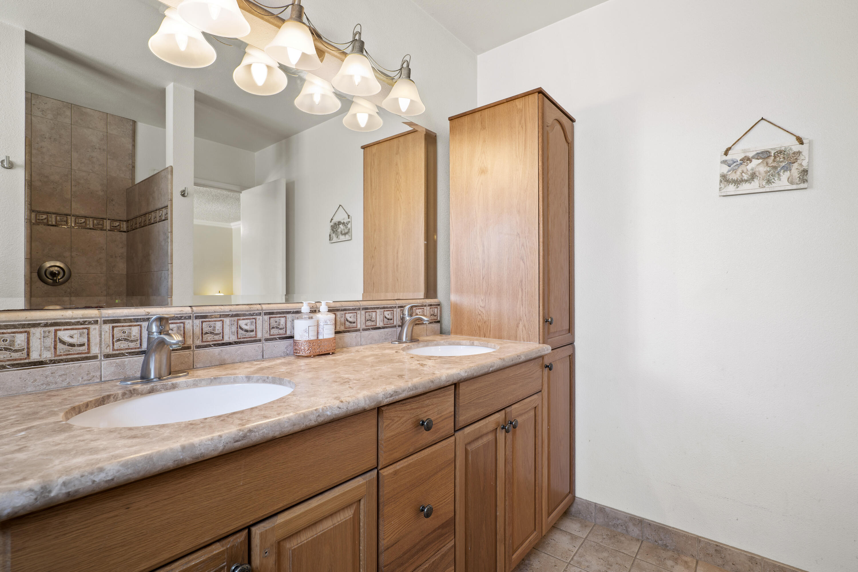 41235 47th Street West Lancaster, CA 93536 - Photo 17 of 43 a bathroom with a granite countertop double vanity sink and a mirror