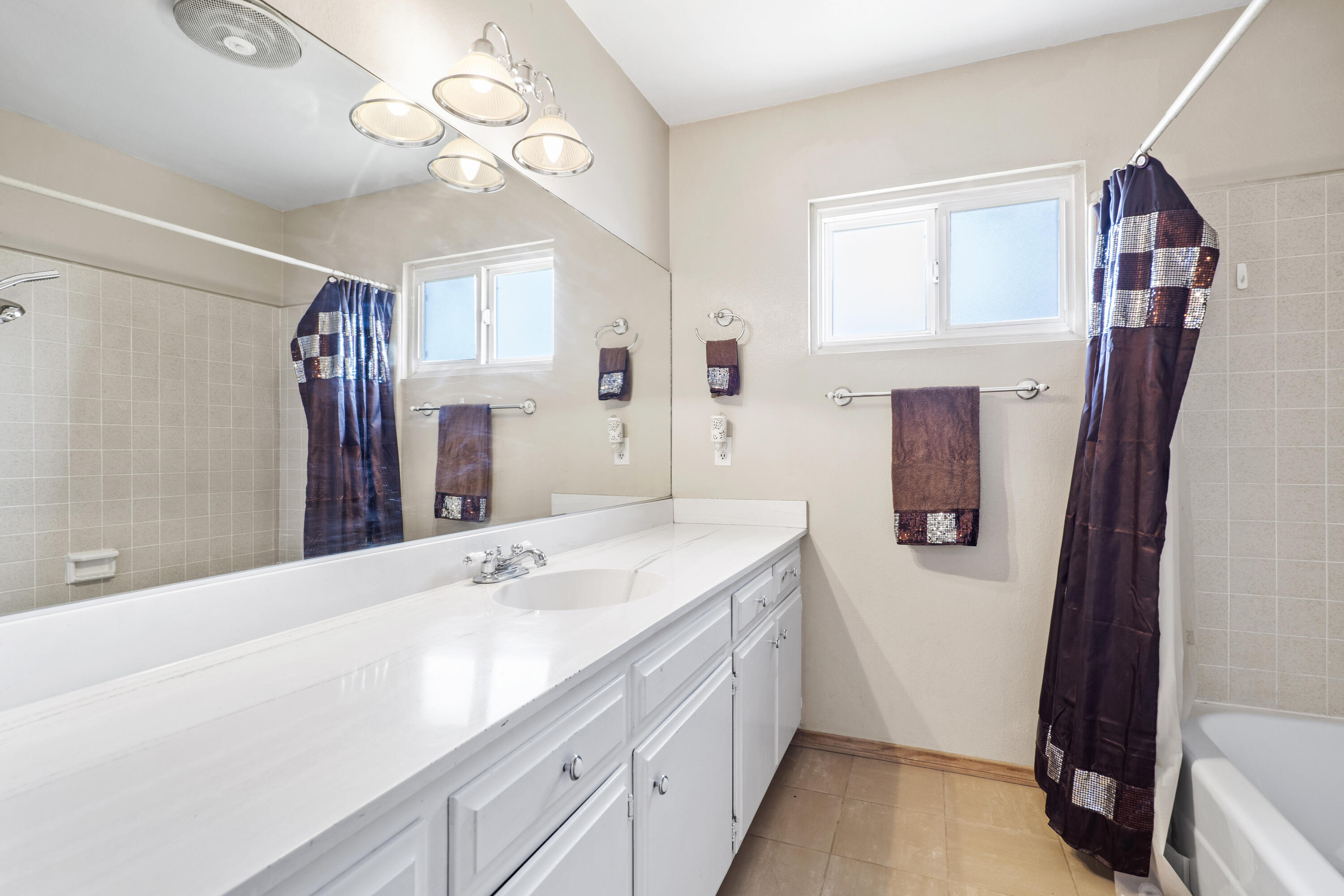 41235 47th Street West Lancaster, CA 93536 - Photo 22 of 43 a bathroom with a sink a vanity and a mirror