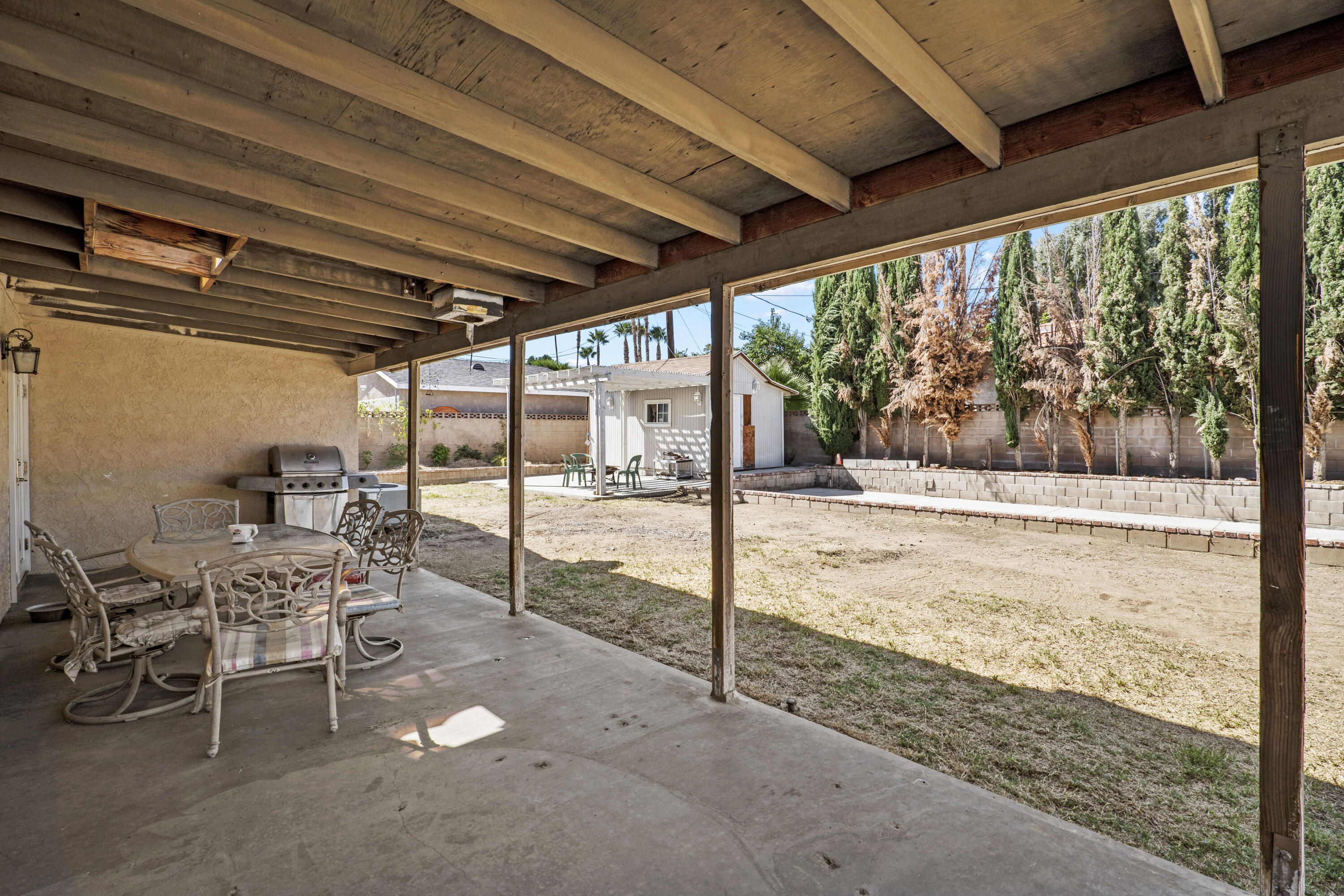 41235 47th Street West Lancaster, CA 93536 - Photo 24 of 43 a view of a porch with chairs and backyard