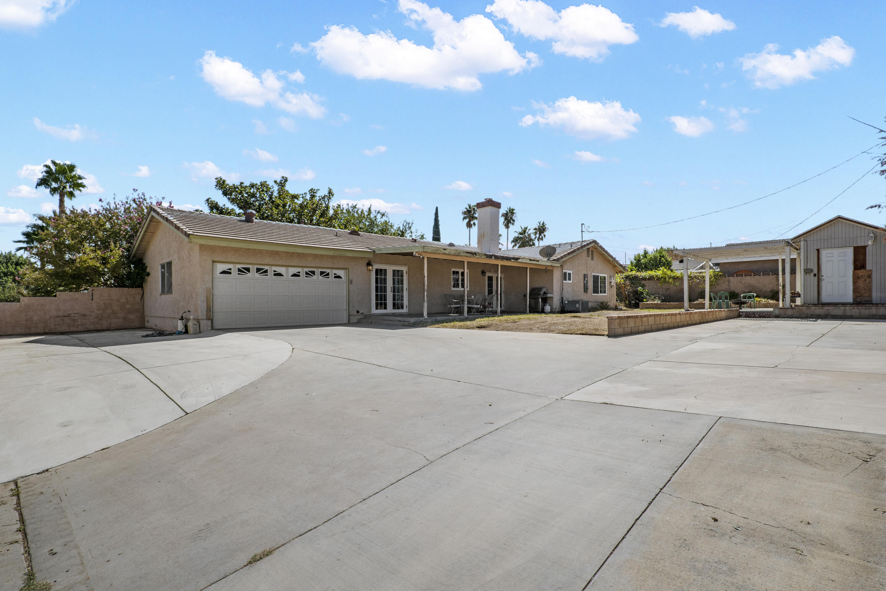 41235 47th Street West Lancaster, CA 93536 - Photo 26 of 43 a front view of a house with a yard