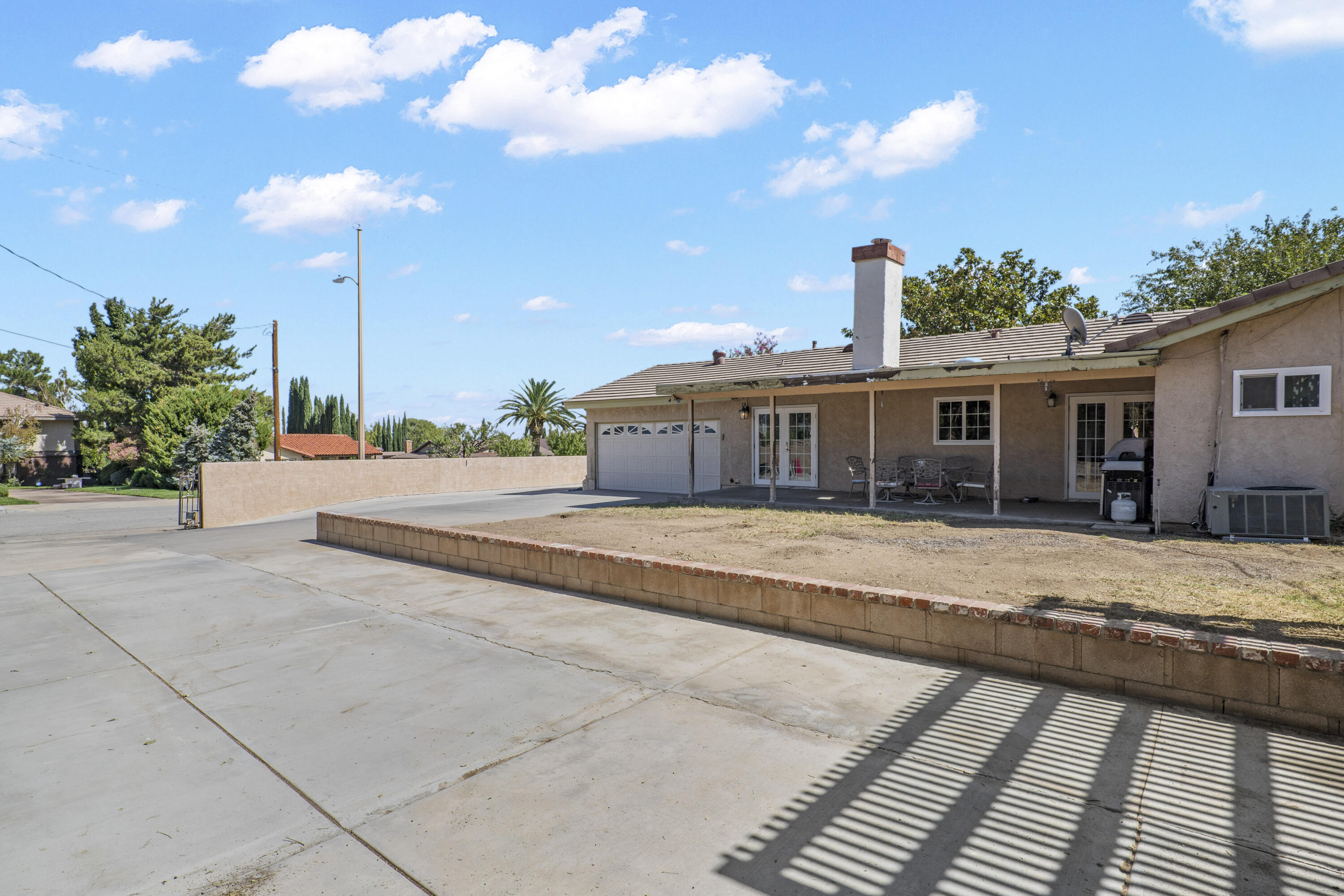 41235 47th Street West Lancaster, CA 93536 - Photo 27 of 43 a view of a house with a patio