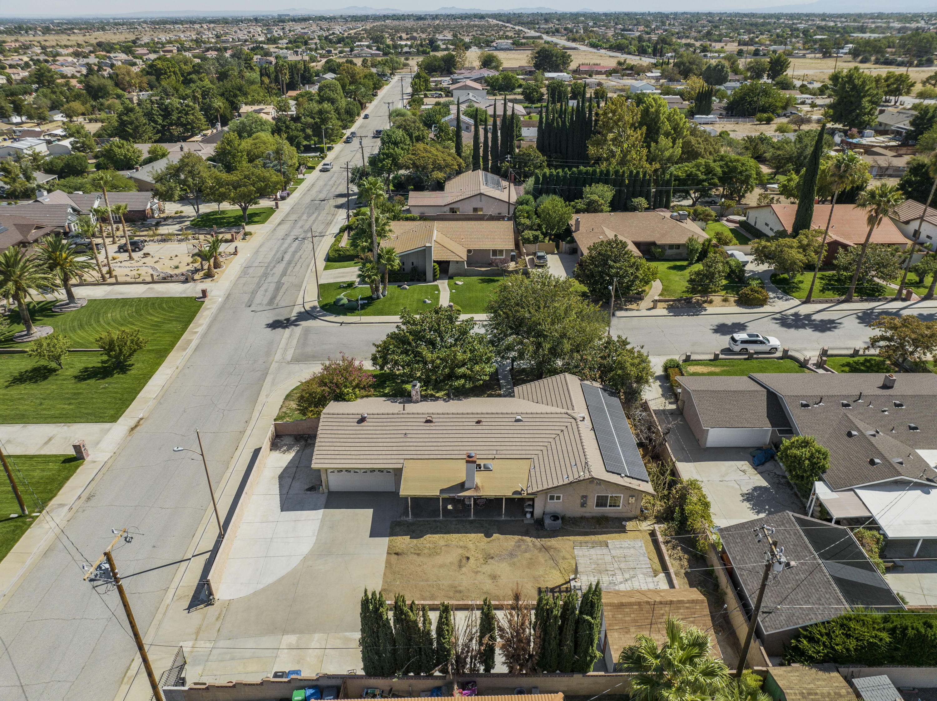 41235 47th Street West Lancaster, CA 93536 - Photo 35 of 43 an aerial view of a house with a yard and lake view